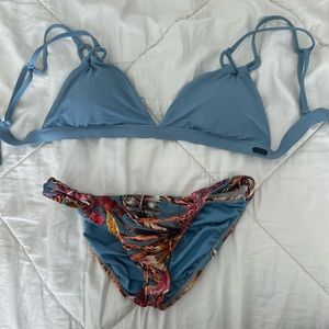 Blue bikini halter top. Floral leaf swim bottoms.